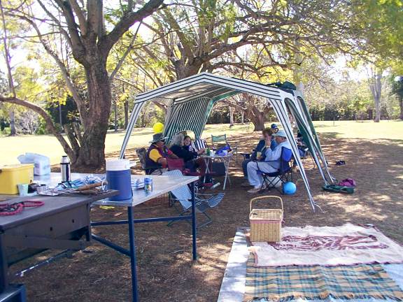 Club Members sitting in the shade.