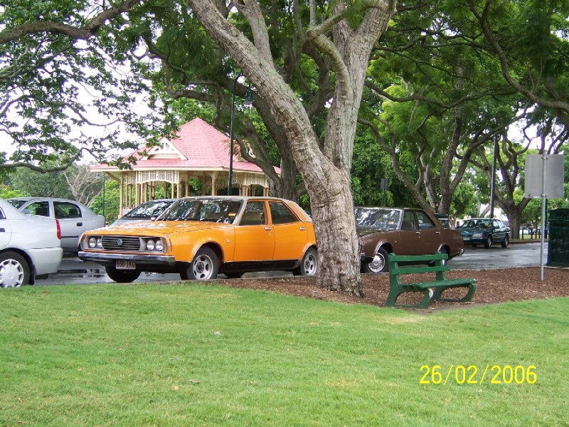 Cars park on road